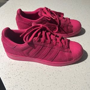 Pink Adidas Superstar shoes